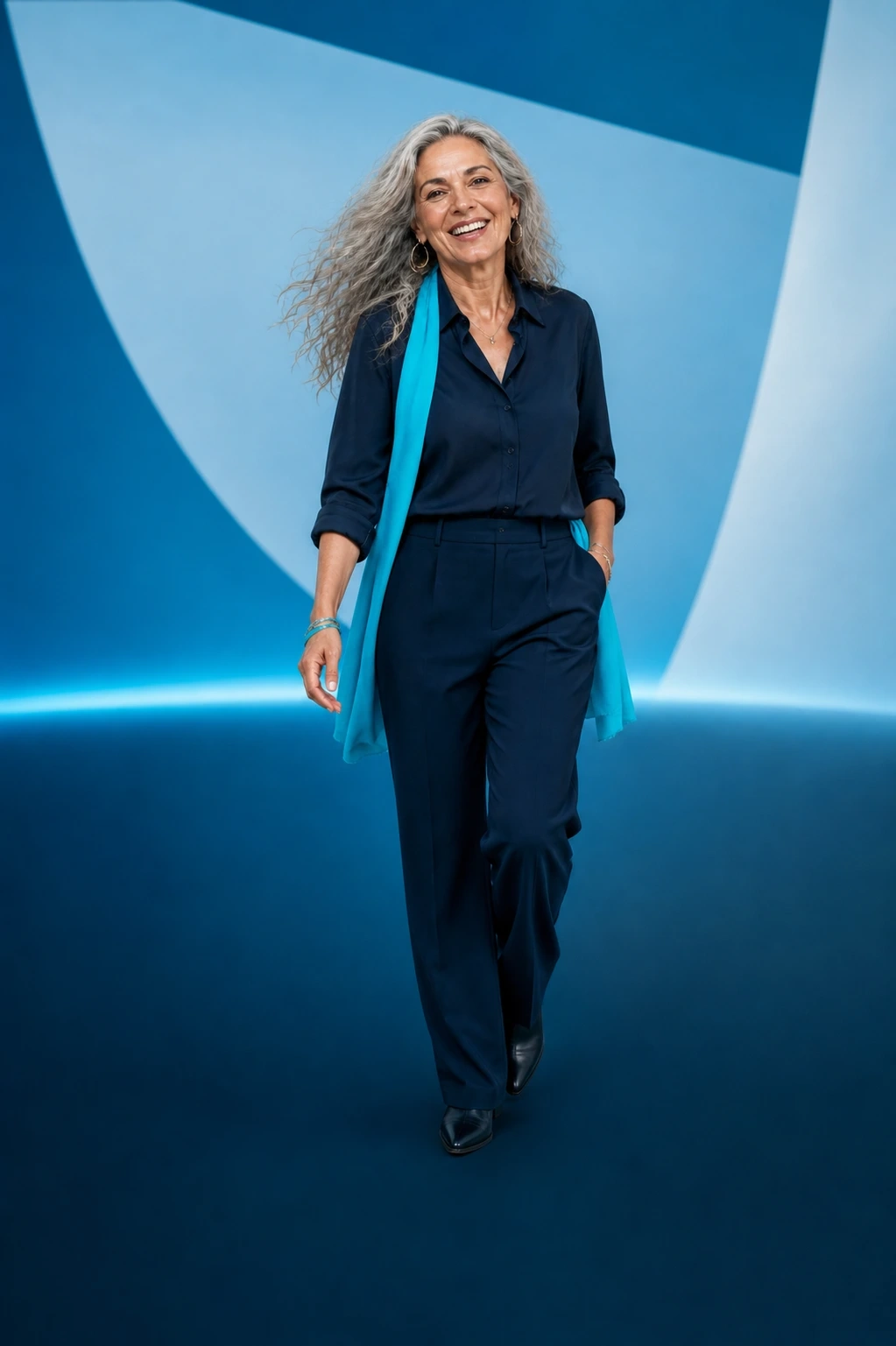 Smiling midlife woman walking forward in a blue studio
